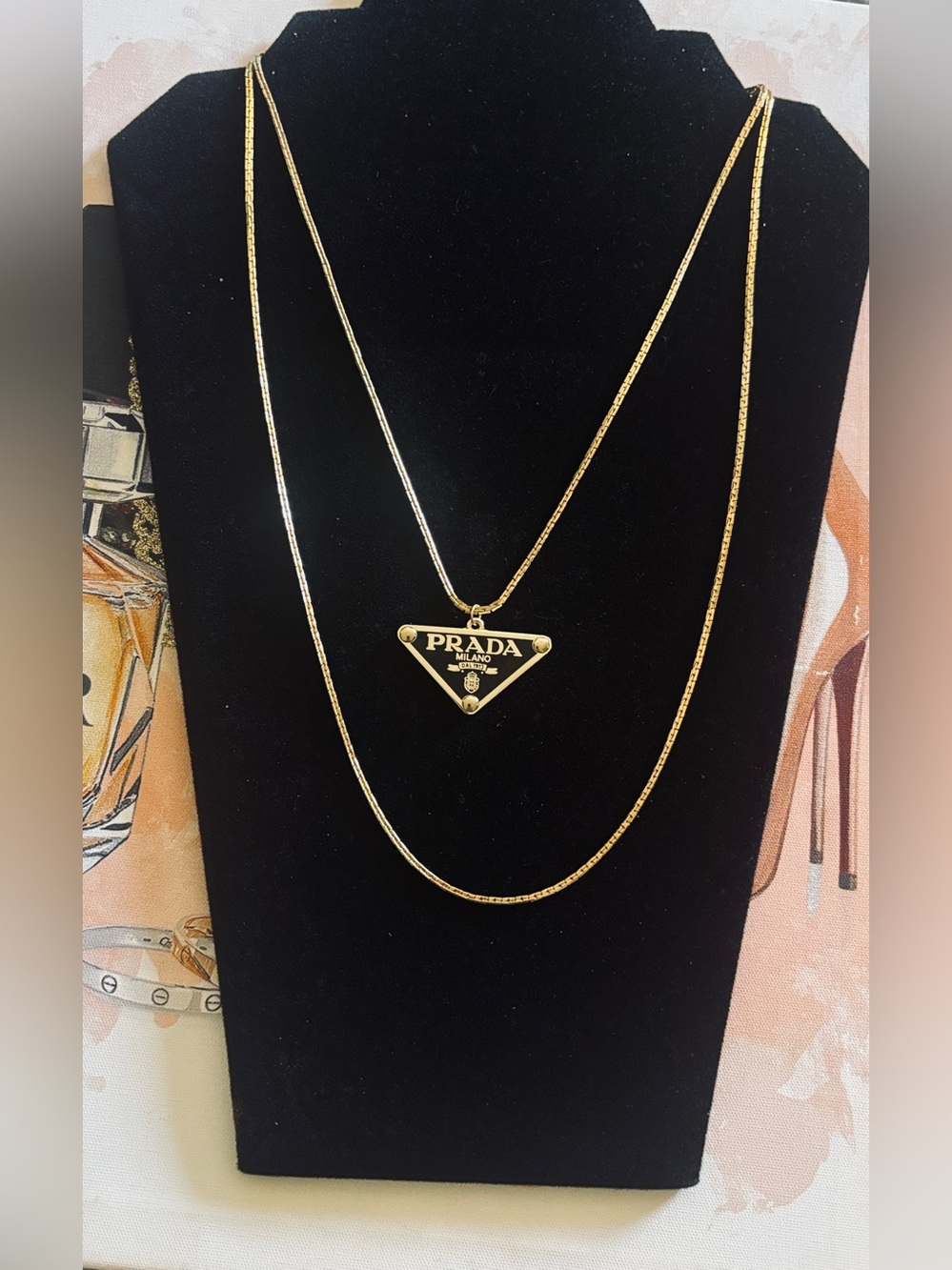 Prada Black and Gold Triangle Logo Pendant Necklace